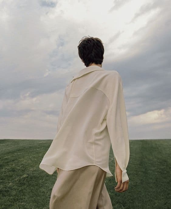 A shirt catching the wind in open country under a wide sky